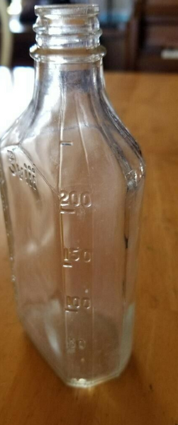 Vintage Clear Glass Apothecary Bottle with measurement markings